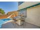 Outdoor kitchen and bar near the pool with a built-in grill and seating space at 3624 Snowy Pines St, Las Vegas, NV 89147