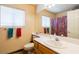 Bathroom featuring a vanity with a sink, a large mirror, and tiled floors at 3738 Amber Lantern Cir, Las Vegas, NV 89147