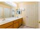 Bathroom with double vanity and large mirror at 3738 Amber Lantern Cir, Las Vegas, NV 89147