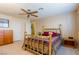 Bedroom featuring a brass bed frame and a ceiling fan at 3738 Amber Lantern Cir, Las Vegas, NV 89147