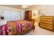 This bedroom boasts an ensuite bath and a mirrored closet with ample storage space at 3738 Amber Lantern Cir, Las Vegas, NV 89147