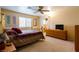 Bedroom with dresser, ceiling fan, and natural light at 3738 Amber Lantern Cir, Las Vegas, NV 89147