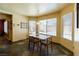 Charming breakfast nook with views of the pool and backyard through bright, sunny windows at 3738 Amber Lantern Cir, Las Vegas, NV 89147