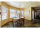 Bright dining area with large windows offering views of the pool, perfect for enjoying meals at 3738 Amber Lantern Cir, Las Vegas, NV 89147