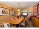 Bright dining room boasts warm tones, modern art, and stylish decor for a sophisticated dining experience at 3738 Amber Lantern Cir, Las Vegas, NV 89147