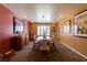 Elegant dining room showcases colorful walls, contemporary artwork, and ample space for entertaining guests at 3738 Amber Lantern Cir, Las Vegas, NV 89147