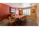 A dining room with a wooden table and set of chairs, and a window at 3738 Amber Lantern Cir, Las Vegas, NV 89147