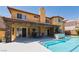 Stunning home with a pool, built in barbecue, and a covered patio ideal for outdoor entertaining at 3738 Amber Lantern Cir, Las Vegas, NV 89147