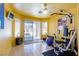 Home gym with exercise equipment, natural light, and direct access to the outdoors at 3738 Amber Lantern Cir, Las Vegas, NV 89147