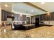 Modern kitchen equipped with stainless appliances, granite countertops, and a functional island at 3738 Amber Lantern Cir, Las Vegas, NV 89147