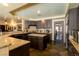 Gourmet kitchen featuring granite countertops, an island, and stainless steel appliances for modern cooking at 3738 Amber Lantern Cir, Las Vegas, NV 89147