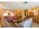 Spacious living room featuring couches, carpets, an archway and staircase at 3738 Amber Lantern Cir, Las Vegas, NV 89147