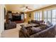 Relaxing living room featuring custom shelving, sofas and plantation shutters at 3738 Amber Lantern Cir, Las Vegas, NV 89147