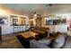 Living room with a high-top bar, seamless flow into the kitchen, and large comfortable sofas at 3738 Amber Lantern Cir, Las Vegas, NV 89147