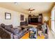 Cozy living room featuring built-in entertainment center and comfortable seating at 3738 Amber Lantern Cir, Las Vegas, NV 89147