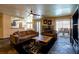An open-concept living room with comfortable sofas and a view into the kitchen and dining area at 3738 Amber Lantern Cir, Las Vegas, NV 89147
