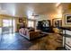 Spacious living room with a fireplace, tile flooring, and sliding glass doors to the outdoor patio at 3738 Amber Lantern Cir, Las Vegas, NV 89147