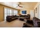 Spacious living room with plantation shutters and comfortable seating arrangement at 3738 Amber Lantern Cir, Las Vegas, NV 89147