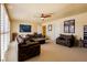 Comfortable living room featuring plantation shutters and ample seating at 3738 Amber Lantern Cir, Las Vegas, NV 89147
