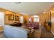 Open-concept living room featuring plush seating, lighting, and decor at 3738 Amber Lantern Cir, Las Vegas, NV 89147