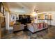 Spacious living room featuring tiled floors, comfortable seating, and a bar, ideal for relaxation at 3738 Amber Lantern Cir, Las Vegas, NV 89147