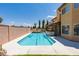 Enjoy the outdoors with this pool and patio surrounded by a privacy wall at 3738 Amber Lantern Cir, Las Vegas, NV 89147