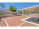 Spacious backyard featuring a covered patio, gravel landscaping, and a walled perimeter for added privacy at 3741 Cactus Wheel Ct, Las Vegas, NV 89129