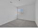A bedroom with neutral walls and plush carpet has a window for natural light at 3741 Cactus Wheel Ct, Las Vegas, NV 89129