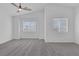 Spacious bedroom with vaulted ceiling, neutral carpet, and multiple windows providing natural light at 3741 Cactus Wheel Ct, Las Vegas, NV 89129