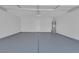 Spacious garage with sealed concrete flooring and a door to the interior at 3741 Cactus Wheel Ct, Las Vegas, NV 89129