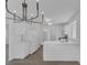 Bright kitchen boasts stone countertops and stainless appliances with view of the bathroom at 3741 Cactus Wheel Ct, Las Vegas, NV 89129