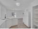 Bright kitchen with stainless appliances, stone countertops, and white cabinets at 3741 Cactus Wheel Ct, Las Vegas, NV 89129