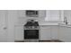 Bright kitchen features stainless steel appliances, white cabinets, and light countertops at 3741 Cactus Wheel Ct, Las Vegas, NV 89129