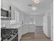 Modern kitchen with stainless steel appliances, white cabinets, and lots of natural light at 3741 Cactus Wheel Ct, Las Vegas, NV 89129