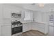 Well-lit kitchen with stainless steel appliances and white cabinets at 3741 Cactus Wheel Ct, Las Vegas, NV 89129