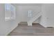 Bright living room featuring wood-look floors, staircase, and fresh white paint at 3741 Cactus Wheel Ct, Las Vegas, NV 89129