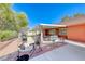Landscaped backyard featuring a covered patio area for outdoor entertaining at 4045 N Chieftain St, Las Vegas, NV 89129