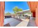 Backyard oasis with covered patio, outdoor seating, and relaxing hot tub at 4045 N Chieftain St, Las Vegas, NV 89129