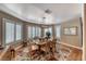 This dining room features a wooden table, seating for six, and bright natural light at 4045 N Chieftain St, Las Vegas, NV 89129
