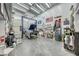Spacious garage featuring a car lift, organized tools, and ample workspace at 4045 N Chieftain St, Las Vegas, NV 89129