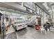 Large garage with multiple vehicles, storage cabinets, and bright lighting at 4045 N Chieftain St, Las Vegas, NV 89129