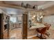 Open kitchen with breakfast bar, stainless appliances, and custom cabinets for ample storage at 4045 N Chieftain St, Las Vegas, NV 89129