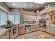 Well-lit kitchen features stainless steel appliances, granite countertops, and updated cabinetry at 4045 N Chieftain St, Las Vegas, NV 89129