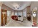 Bright living room with plush carpet, shuttered windows, and stylish furniture at 4045 N Chieftain St, Las Vegas, NV 89129