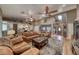 Inviting living room with hardwood floors, neutral walls, ceiling fan and open access to kitchen with granite counters at 4045 N Chieftain St, Las Vegas, NV 89129