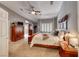 Spacious main bedroom with vaulted ceiling, plantation shutters, and en suite bathroom at 4045 N Chieftain St, Las Vegas, NV 89129