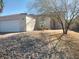 Single-story home featuring a low-maintenance desert rock yard at 424 Wright Way, Henderson, NV 89015