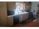A functional kitchen showcases a stainless steel gas range and wood cabinets at 424 Wright Way, Henderson, NV 89015