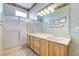 Bathroom with a large vanity mirror and double sinks with a separate shower at 4636 Riva De Romanza St, Las Vegas, NV 89135