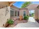 Charming courtyard featuring a fountain, mature plants, and direct access to the front entrance at 4636 Riva De Romanza St, Las Vegas, NV 89135